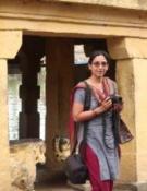 Archana in front of a temple