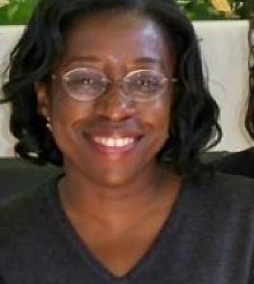 Professor Adejunmobi, smiling at the viewer