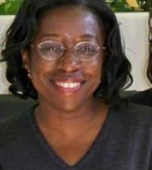 Professor Adejunmobi, smiling at the viewer