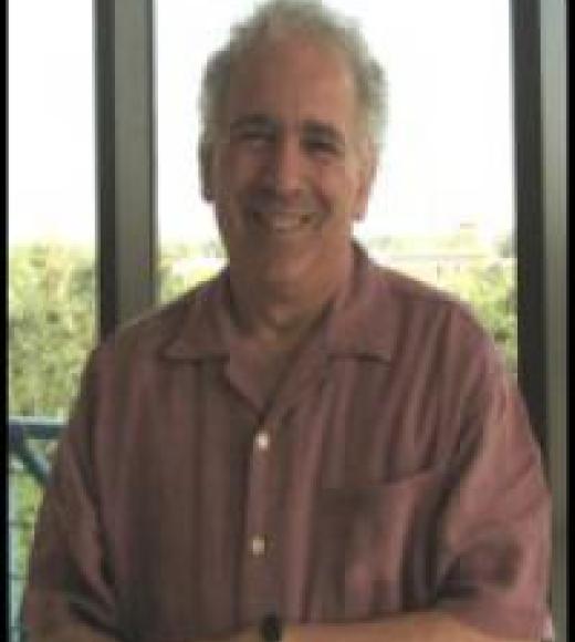 A picture of Professor Schein, smiling at the viewer