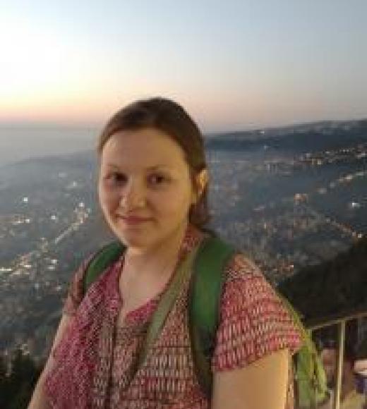 A picture of Liliya Galenkova-Riggs, smiling at the viewer