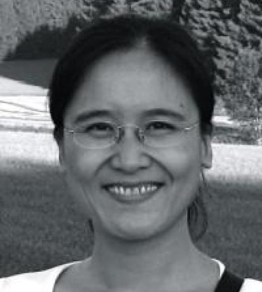 A picture of Professor Zhang, smiling at the viewer