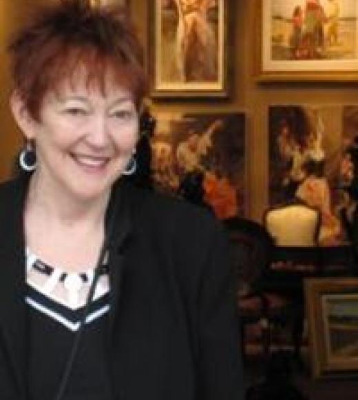 A picture of the Professor, standing in front of pictures