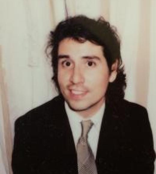 Ross Hernandez smiling at the viewer
