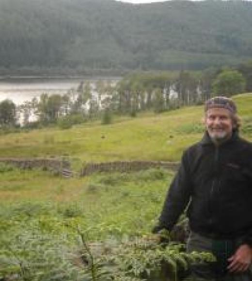 A picture of Professor McLean at the left, in a nature scene.