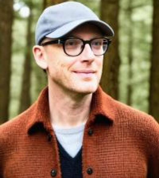 Man wearing a baseball cap in the woods