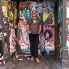 Jeff Fort in front of graffitied wall