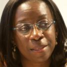 Woman in glasses looking off to the side