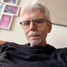 Man in glasses and black shirt