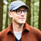 Man wearing a baseball cap in the woods